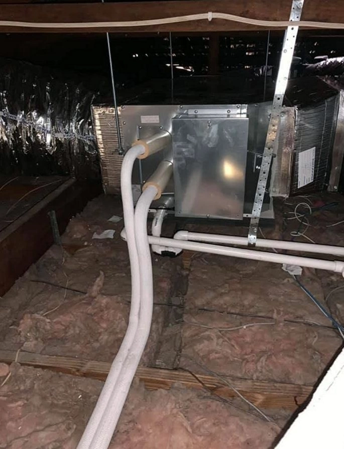 HVAC technician performing seasonal maintenance on a heating system